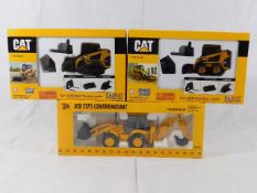 Two boxed CAT & one JCB heavy machinery models