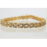 A fine 18ct gold bracelet set with 10ct of diamond