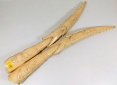 A pair of c.1900 tribal art carved ivory tusks with crocodile decor 20.5in long