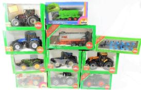Eleven boxed Siku diecast tractors & agricultural vehicles