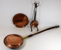 A copper bed pan twinned with other copper items