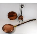 A copper bed pan twinned with other copper items