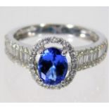 An 18ct white gold tanzanite & diamond cluster rin