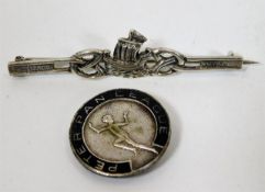 A Peter Pan League badge twinned with a Scandinavi