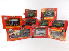 Nine boxed diecast Britain Landrover & trailer mod