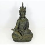 A Tibetan bronze Buddha with right hand holding va