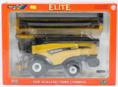 A boxed diecast Fendt combine harvester with one o