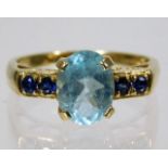 A 9ct gold ring set with topaz & sapphire 2.9g siz