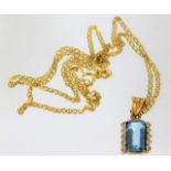 An 18ct gold chain & pendant set with diamonds & a