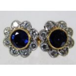 A pair of 18ct gold earrings set with sapphire & d