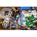 A large box of vintage Lego items