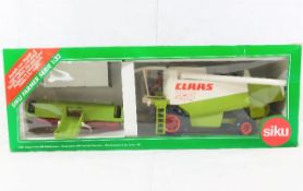 A boxed diecast Claas Lexion 480 Combine harvester