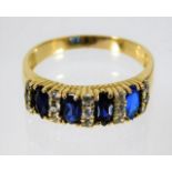 A yellow metal ring, tests as 18ct, set with sapphire & diamonds 4.2g size S