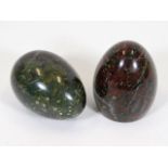 Two large polished serpentine eggs