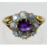 An 18ct gold ring set with amethyst & topaz 3.7g s