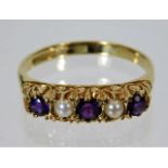 A 9ct gold ring set with amethyst & pearl with car