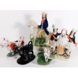 A small collection of Staffordshire figures, cream