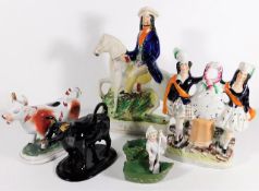 A small collection of Staffordshire figures, cream