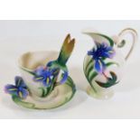 A Franz porcelain hummingbird cup & saucer twinned