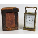 A Victorian brass carriage clock with case