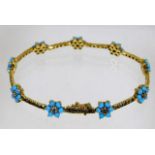 An 18ct gold bracelet set with natural turquoise &