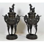 A pair of Chinese censers on stands with decorativ