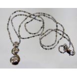 A 14ct white gold necklace & pendant set with thre