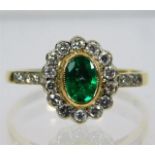 A Victorian 18ct gold ring set with diamond & emer