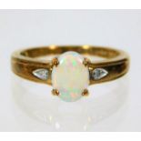 A 9ct gold diamond & opal ring 2.4g size N/O