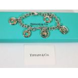 A boxed Tiffany & Co. silver charm bracelet 39.8g