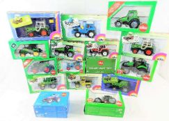 Sixteen boxed Siku diecast tractors & agricultural