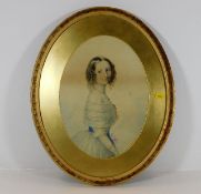A gilt framed oval watercolor of young woman in pe