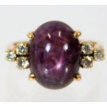 A yellow metal ring set with star ruby & 0.3ct dia