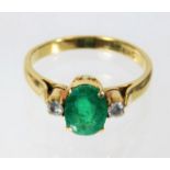 An 18ct emerald & diamond ring 3.3g size O