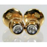 A 9ct gold pair of stud earrings set with diamonds