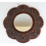 A decorative carved mirror 16.5in