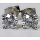 A pair of fine platinum earrings set with 2.11ct diamonds of G/H colour