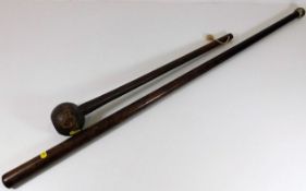 A knobkerrie type club twinned with a metal topped