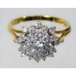 An 18ct gold diamond cluster ring set with 1ct dia