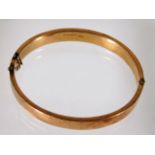 A 9ct rose gold bangle 12.5g