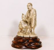 A c.1900 signed Japanese ivory figure group with s