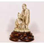 A c.1900 signed Japanese ivory figure group with s