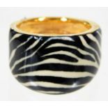 A 21ct gold ring with zebra print enamelled decor