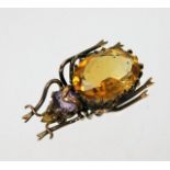 A yellow metal beetle brooch lacking pin set with