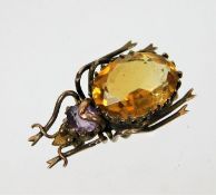 A yellow metal beetle brooch lacking pin set with
