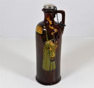 A Doulton Noke whisky bottle with silver stopper &