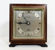 A small Elliott clock with Bowden & Sons Plymouth