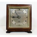 A small Elliott clock with Bowden & Sons Plymouth