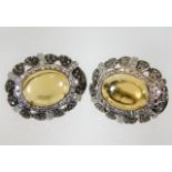 A pair of 18ct white gold earrings set with diamon