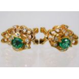 A pair of 14ct gold earrings set with diamonds & S